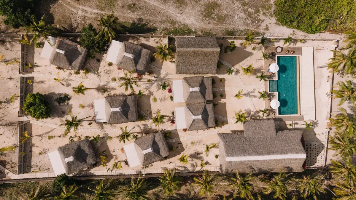 Villa Dolarosa from above: eight thatched rooms around the pool