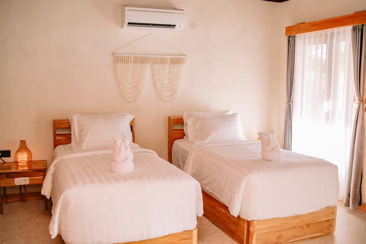 Ground floor of the Family Room with two twin beds and air conditioning