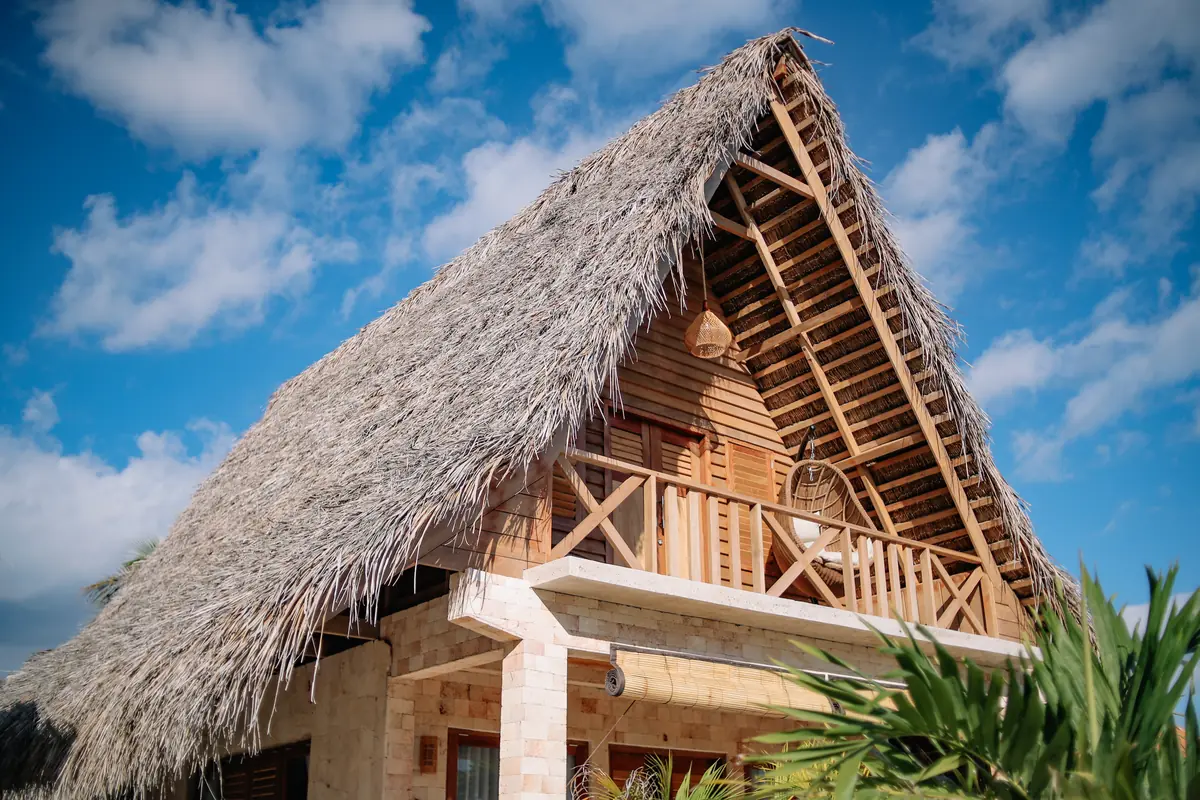 The hand-built timber and thatch A-frame of the Family Room
